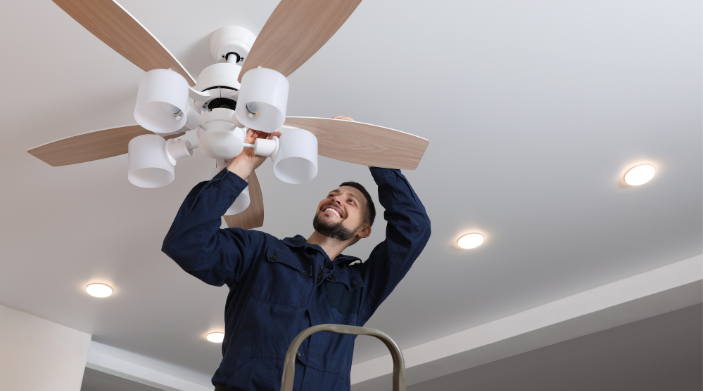 Electrician Repairing Fan in Idaho Falls Home